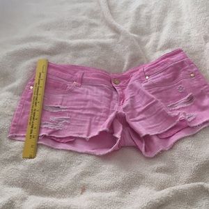 Pink ripped shorts